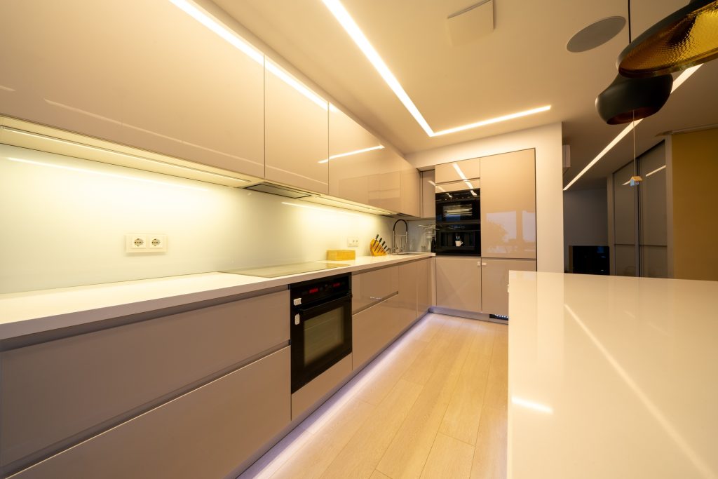 Interior design spacious bright studio apartment in warm pastel beige colors.