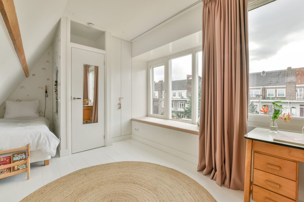 Mansard bedroom with minimalist interior design