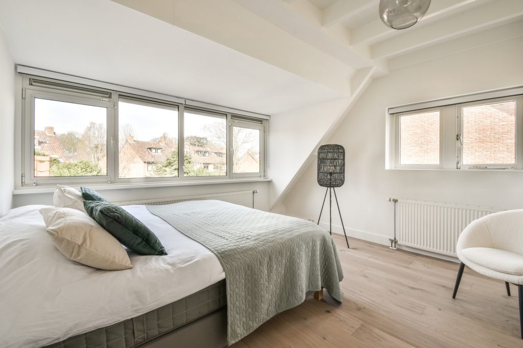 Mansard bedroom with minimalist interior design