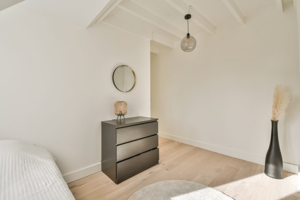 Mansard bedroom with minimalist interior design