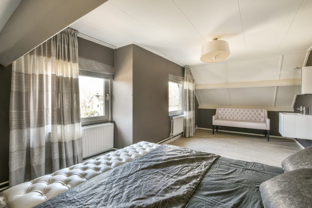 Mansard bedroom with minimalist interior design