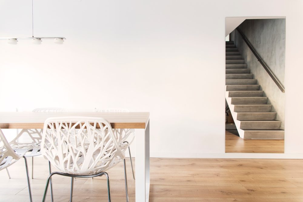 Stylish composition of dining room interior design with table and chairs.