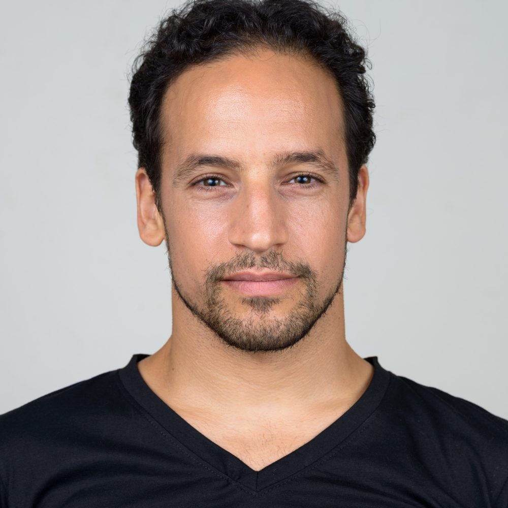 Portrait of handsome bearded Hispanic man
