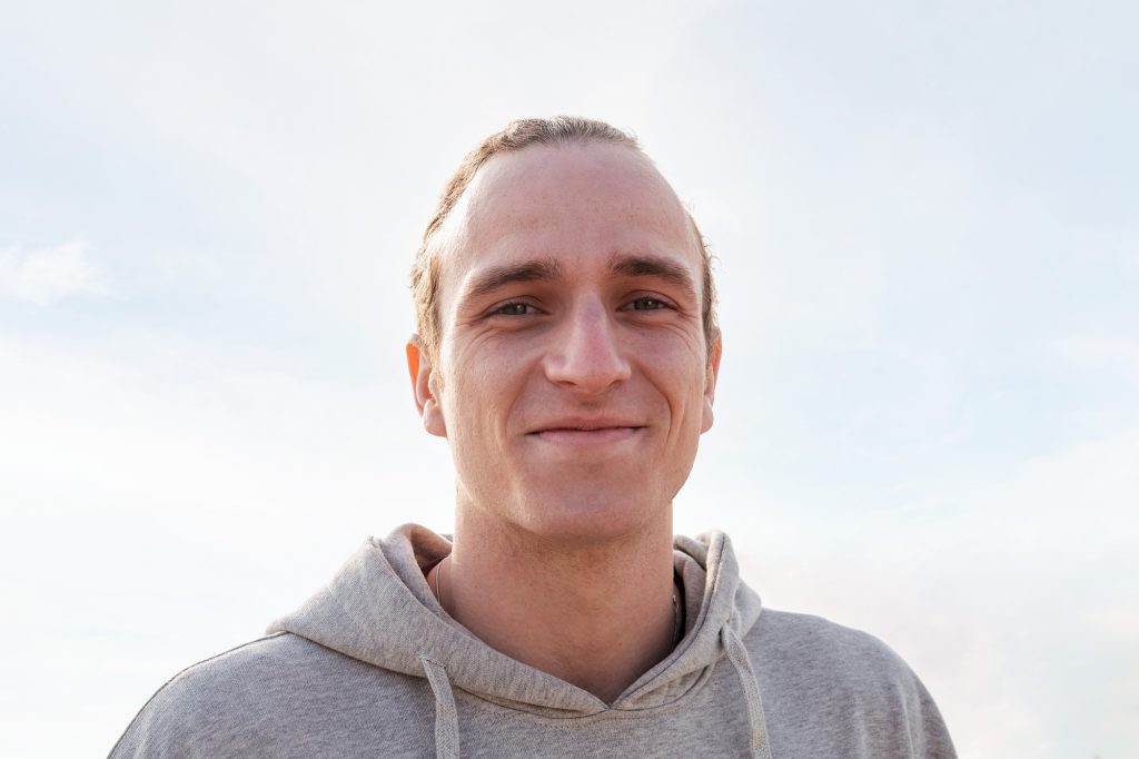caucasian man smiling happy and looking at camera