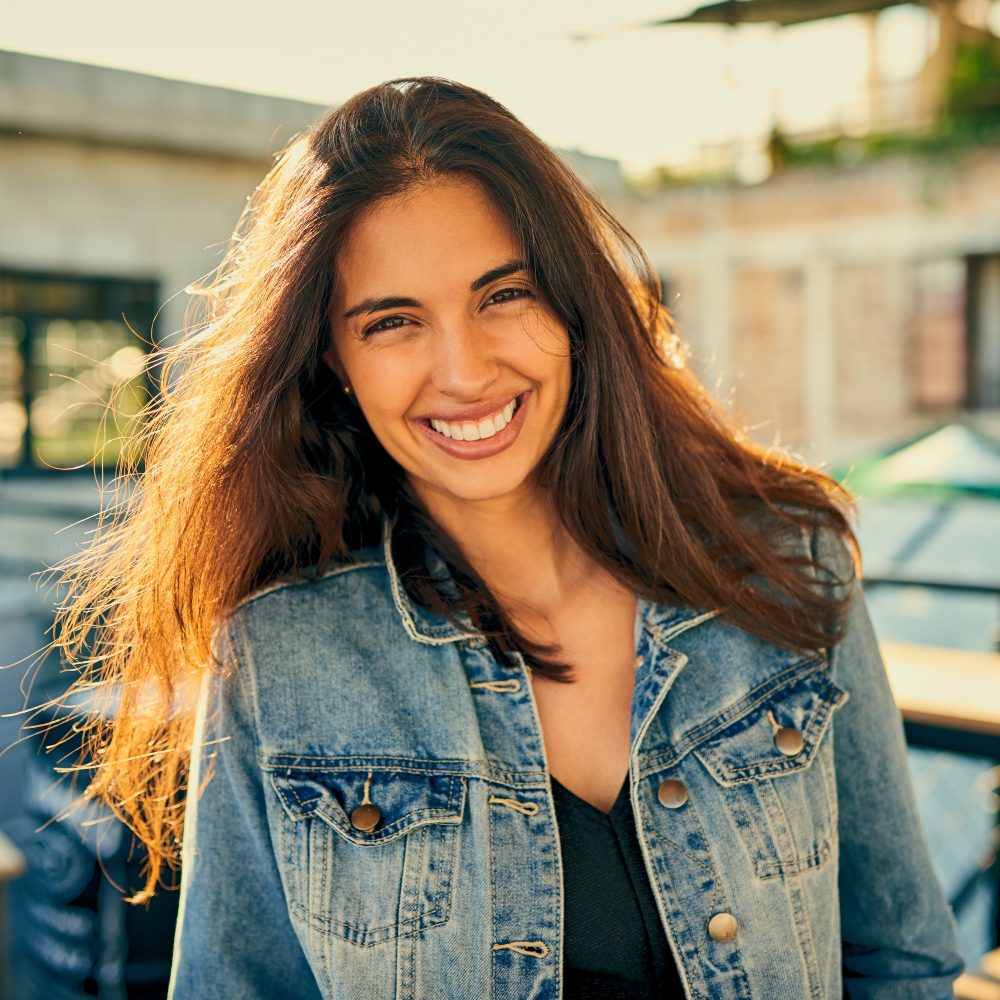 Portrait of an attractive young woman spending the day outside on a rooftop