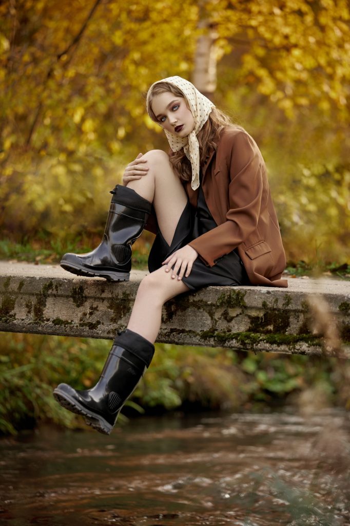 Beautiful portrait of a woman in the village countryside in nature in autumn
