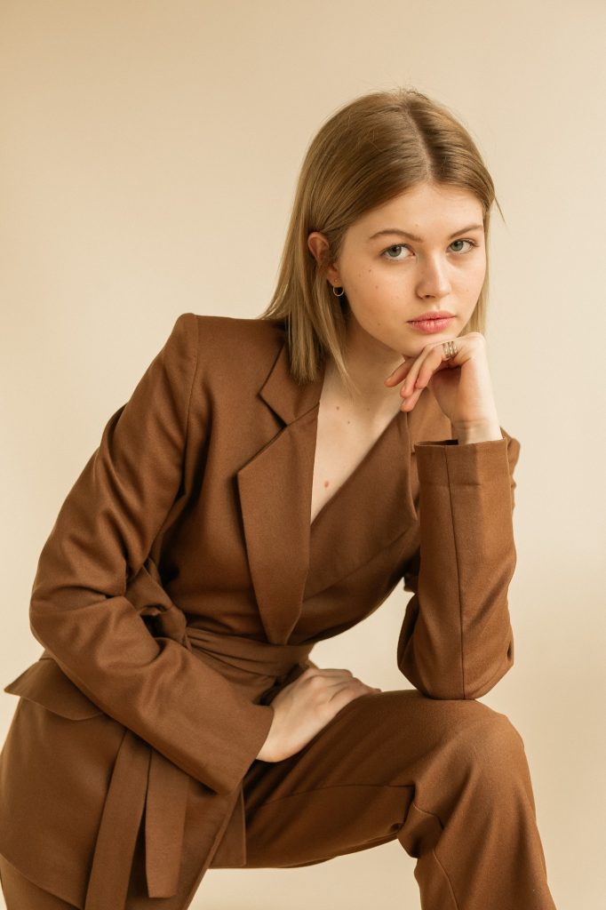 Fashion shooting in studio. Professional model. New autumn fashion trend collection.